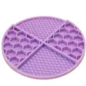 A purple circular slow feeder mat designed for pets with raised sections.